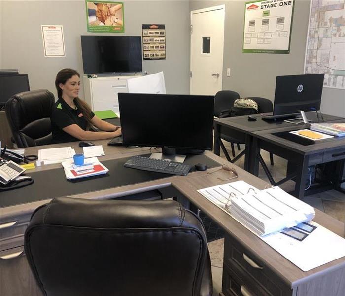 female employee sitting at desk